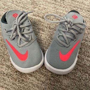 Grey and pink Nikes. Worn once. Size 4c